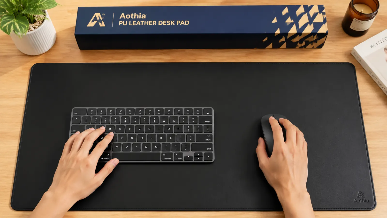 Close-up of a hand placing a wireless mouse on the Aothia desk pad surface showing texture detail